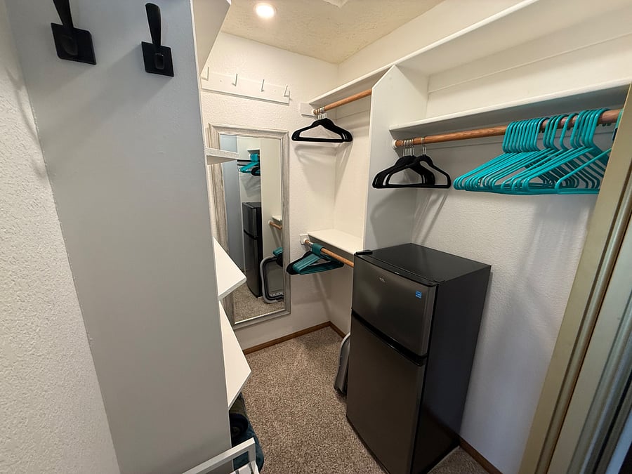 Bedroom 3 closet with mini refrigerator/freezer