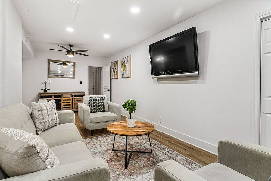 Living room with sofa, 2 loveseats and 55" Smart TV