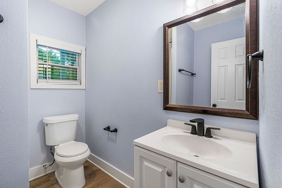 Bathroom with shower attached to main bedroom.