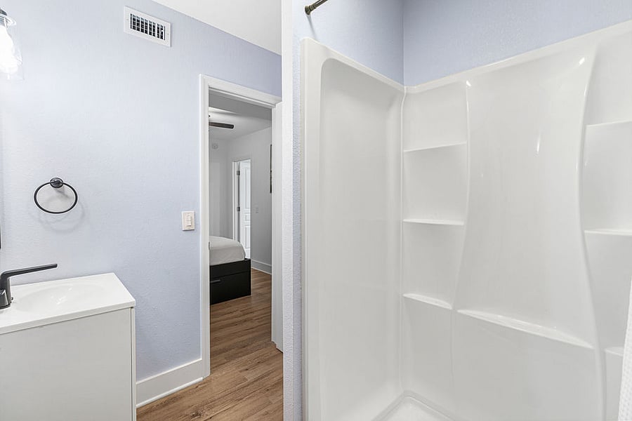 Bathroom with shower attached to main bedroom.