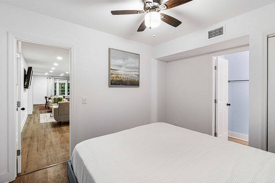 Bedroom 1 with private bathroom and private entrance through fenced in yard.