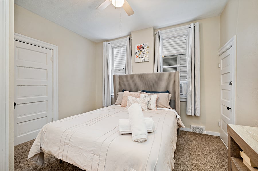 Primary bedroom with comfortable bed and room for extended stays.