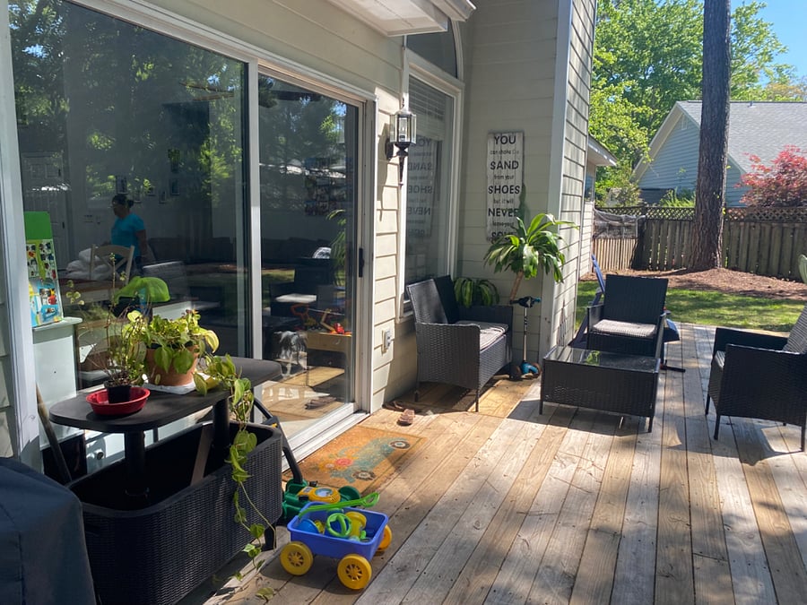 back deck with grill and outdoor furniture