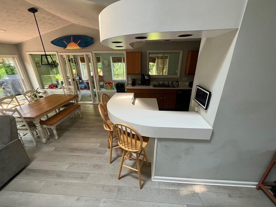 view of kitchen table and bar/island