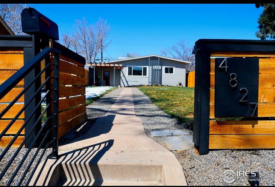 Front gate entrance up the stairs. Showing walkway to home.