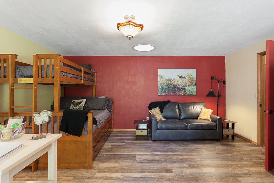 We will be removing the upper bunk. The Queen bed and trundle shown will remain. There also is a full sofa sleeper. 