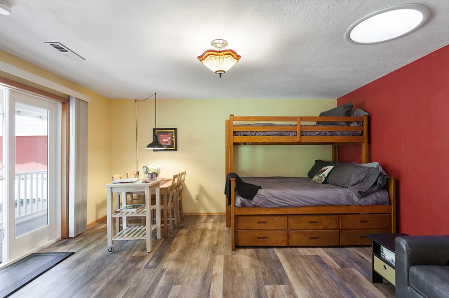 We will be removing the upper bunk. The Queen bed and trundle shown will remain. There also is a full sofa sleeper.