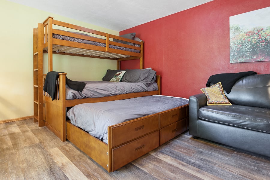 We will be removing the upper bunk. The Queen bed and trundle shown will remain. There also is a full sofa sleeper.
