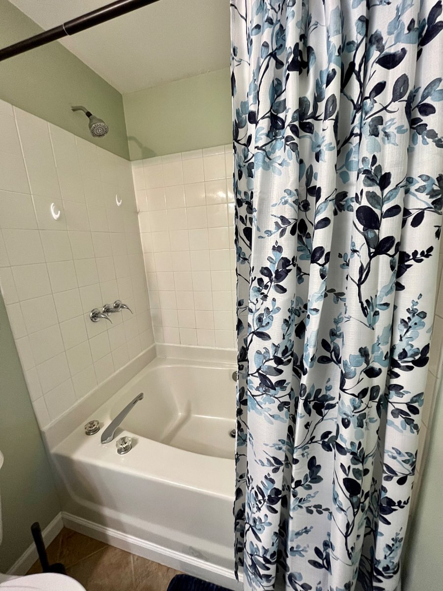 primary bedroom bathroom with soaking tub