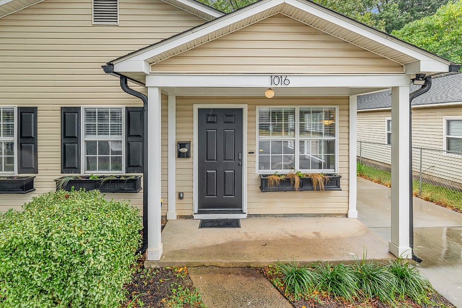 Welcoming front yard and private driveway with parking for up to three vehicles