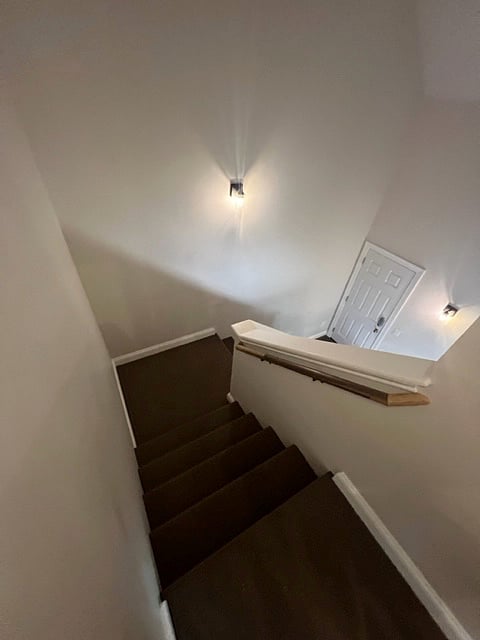 Stairs to upper and lower level
Front door entrance to entire unit below