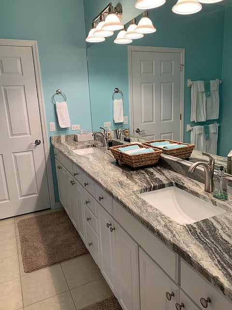Primary bathroom to include double sinks, granite countertops, & walk in shower.