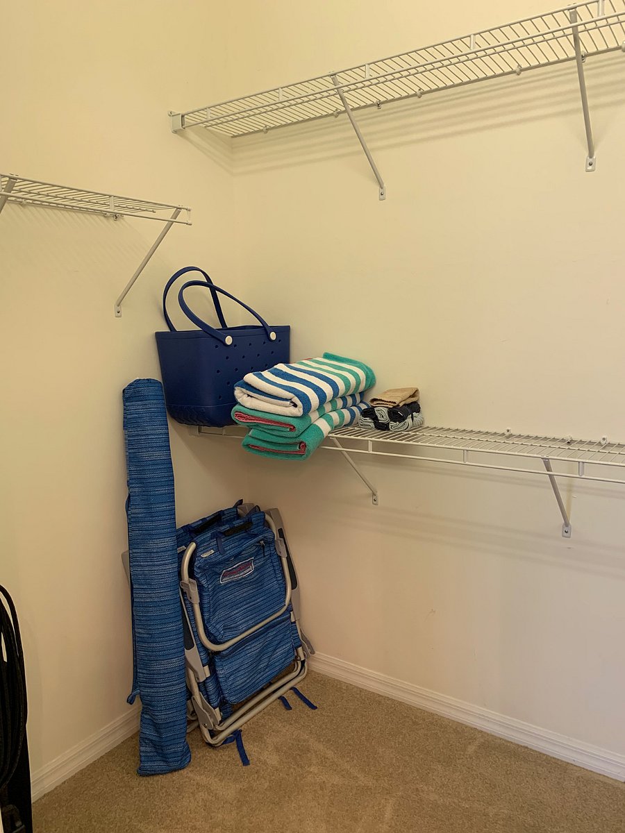 Beach chairs, beach umbrella, beach bag and towels.