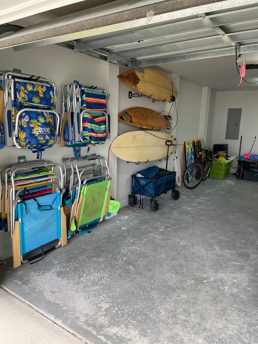 Garage filled with all the beach equipment you could want.