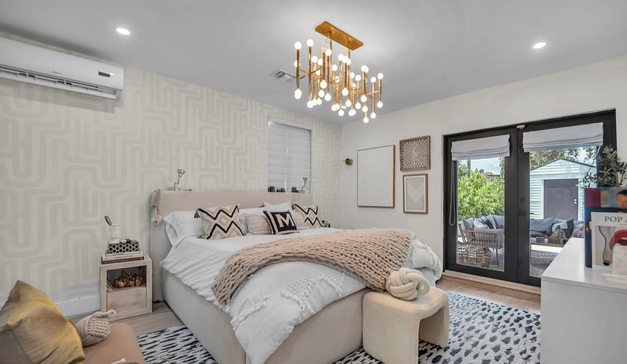 Master bedroom **be advised furniture has been updated and different front picture - double door leads to backyard covered patio