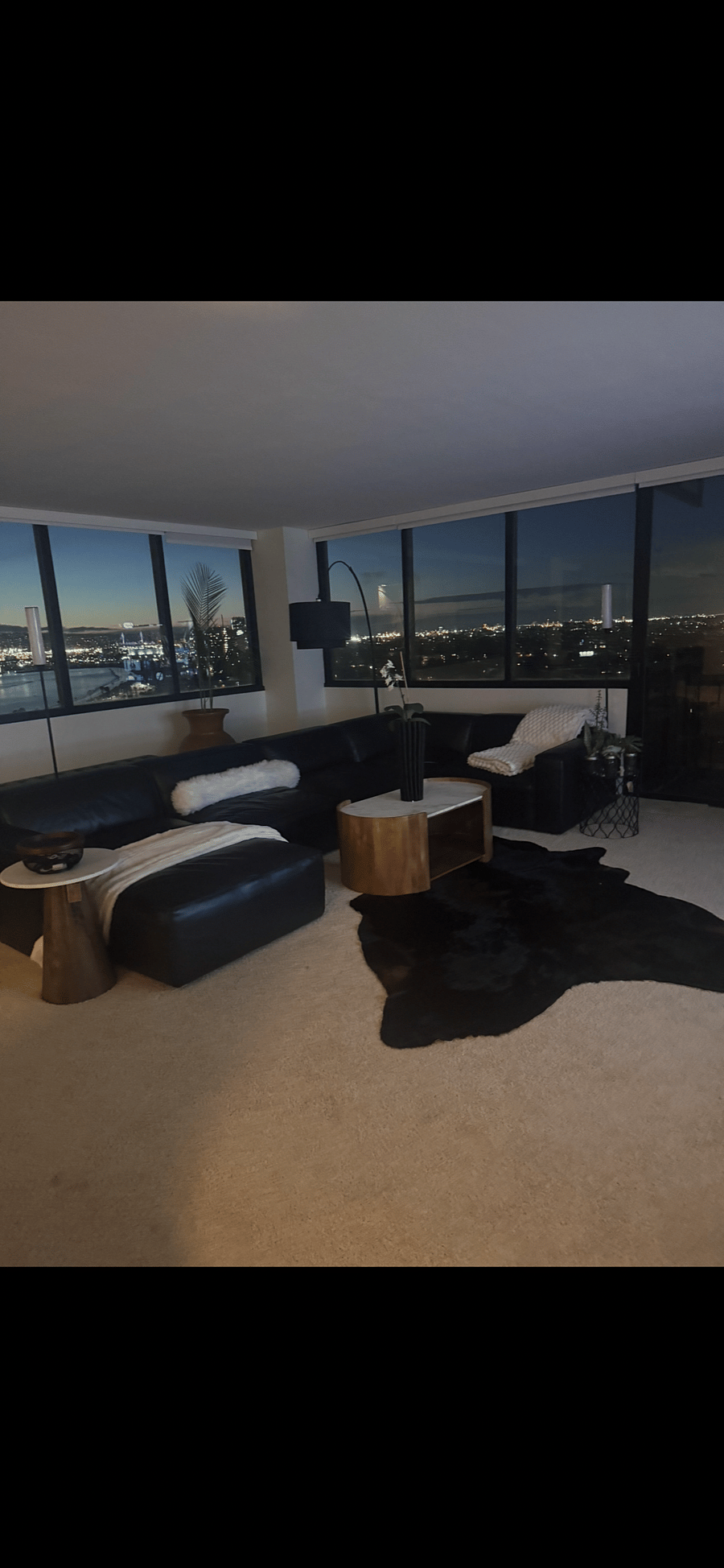 Spacious living room with ocean and city views.Diningroom with Beach, boardwalk, and ocean views.