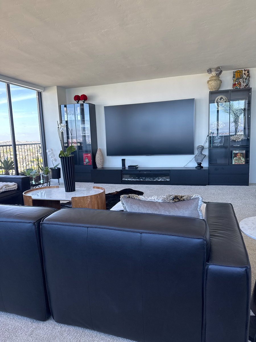 110-inch smart TV in the living room.