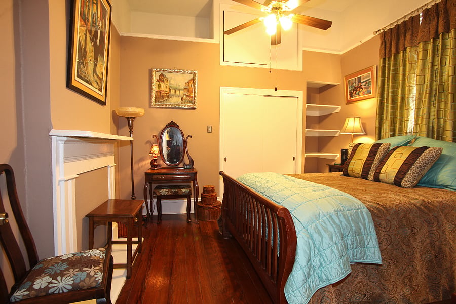 Spacious and nicely furnished apartment with private queen bedroom with ample closet & storage space. 32 TV with DirecTV in the bedroom ~ dressing table with stool and chair.