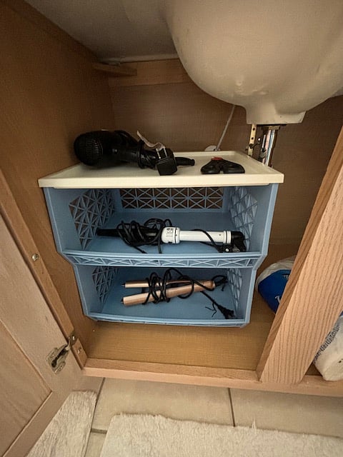 space under the sink. Feel free to use the blow dryer and curling iron.
