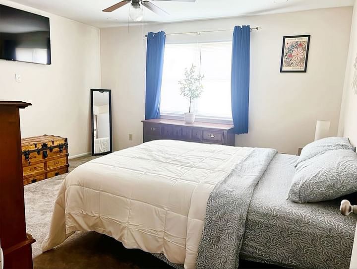 Bedroom 1 equipped with Roku TV and electronic adjustable bed with Memory Foam Mattress. Side Table with charging lamp. Closet in room 