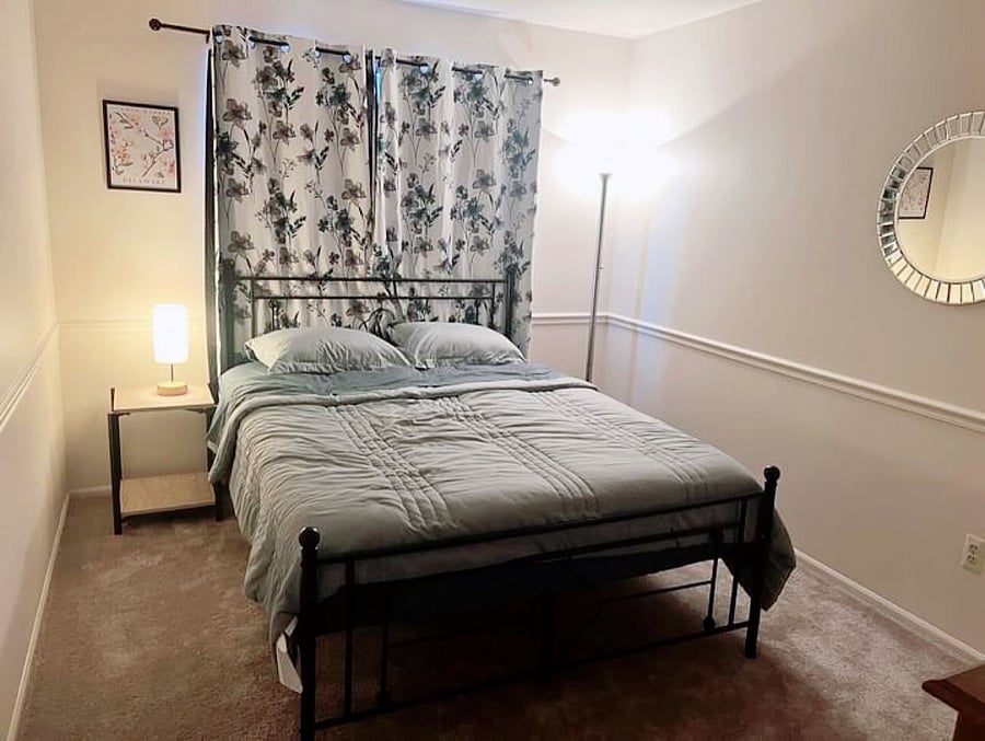 Bedroom 2 equipped with Roku TV and Memory Foam Mattress. Side table with charging lamp. Closet in room 