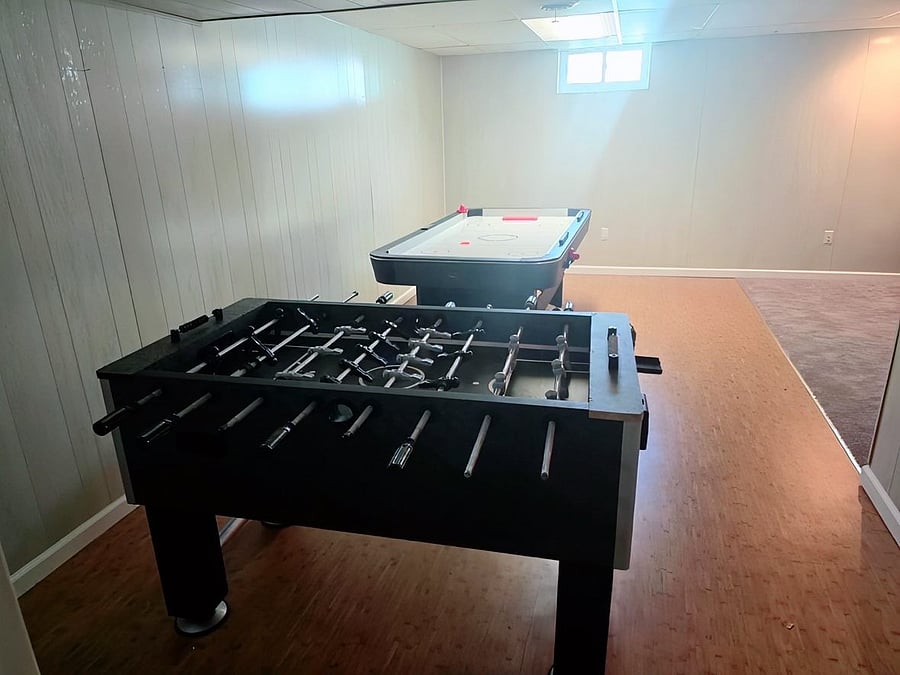 Air Hockey and Foosball Table in basement.