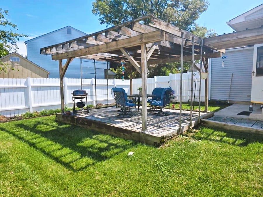 Backyard with Pergola and Grill sitting area. 