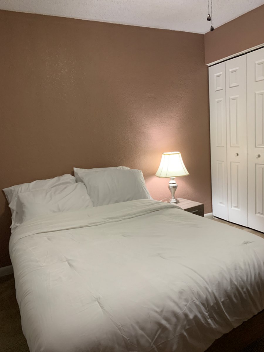 Bedroom 1 with direct back patio access.