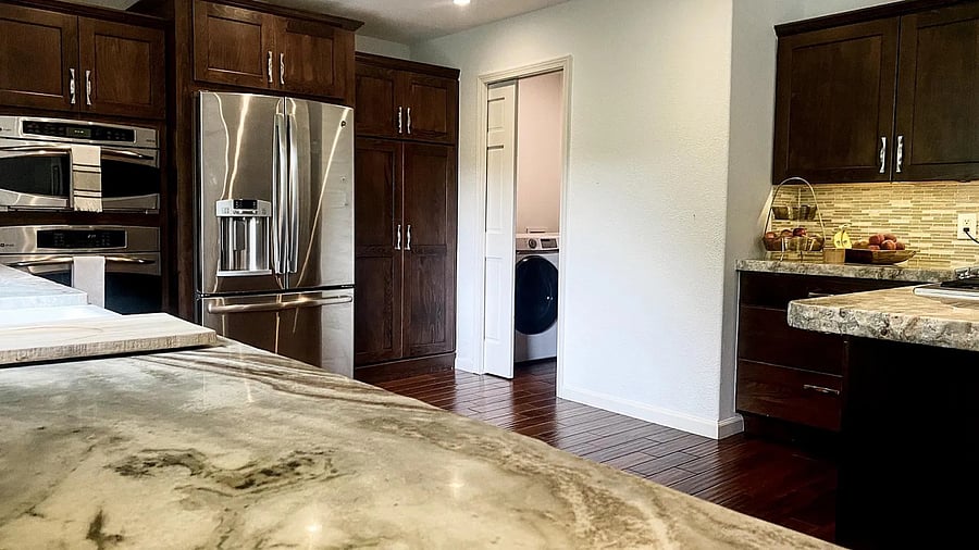 Laundry Room with washer and dryer access through kitchen.