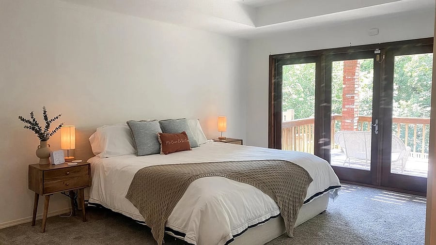 Primary Suite with King size bed and access to exterior lower deck.