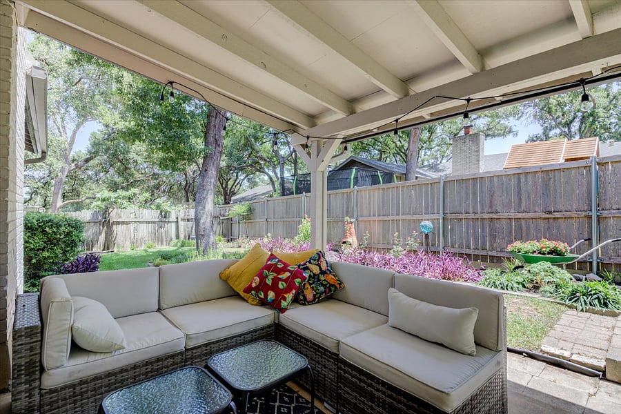 Relax on the backyard porch and enjoy the garden.