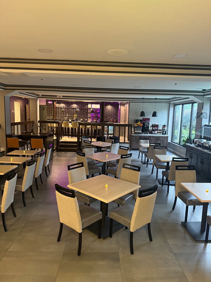 Complimentary breakfast bar featuring a selection of eggs, breakfast meats, pancake machine, waffle makers, gourmet coffee, juices, yogurt machine, and more!