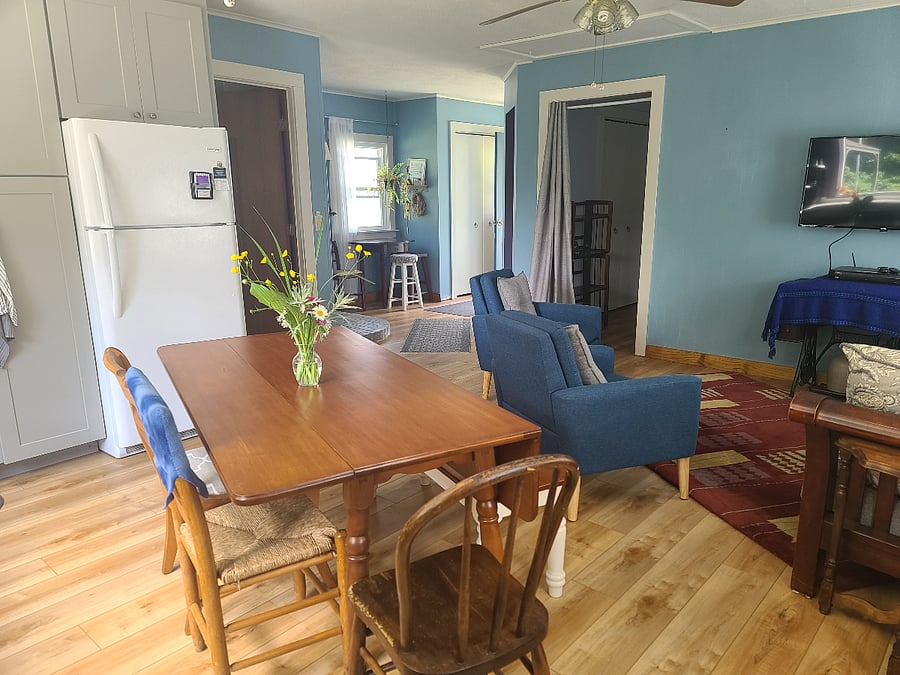 Dining area. This is a drop-leaf table pictured with one side down. There is plenty of room to spread out at this table!