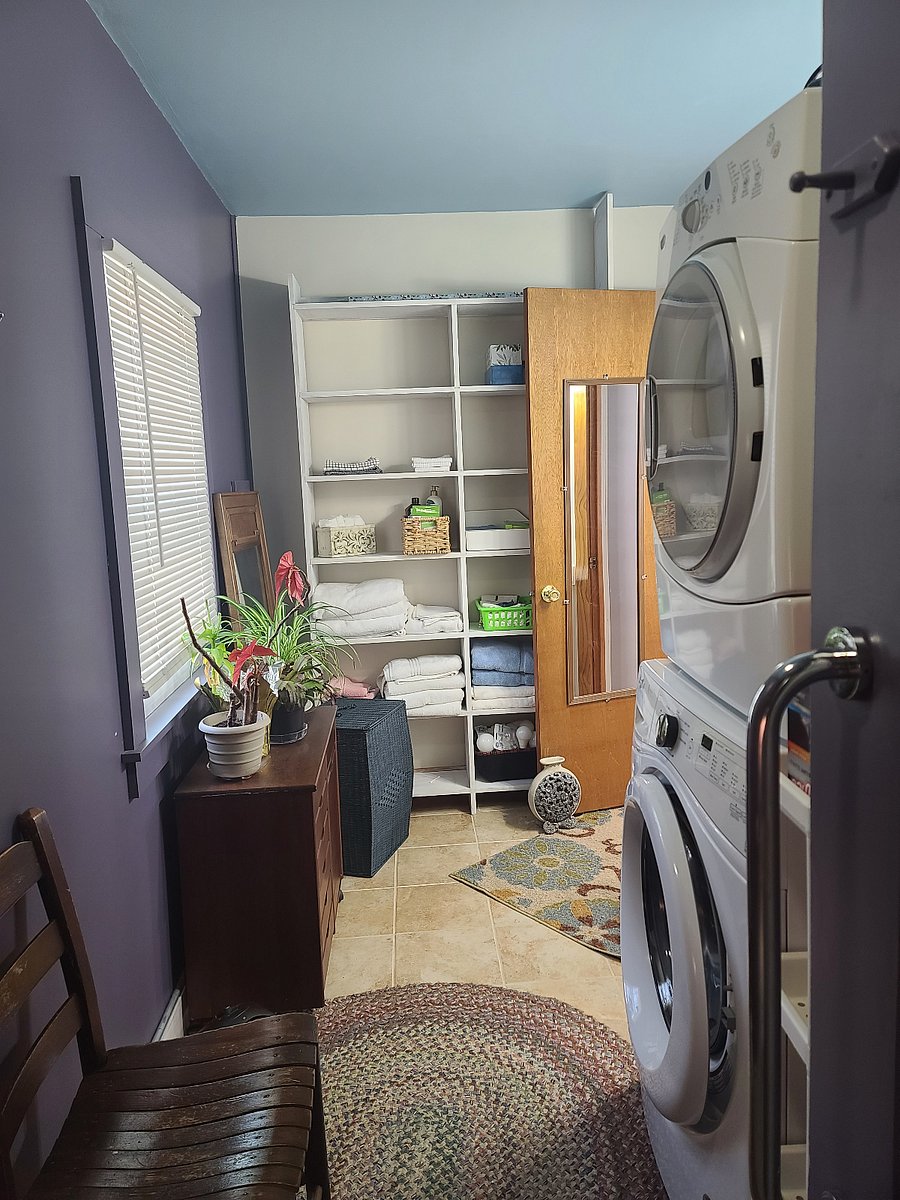 Entering the bathroom. There is a full sized washer and dryer available for guest use.  Shelving and storage for your personal items, as well as plenty of towels, washcloths, and the like.