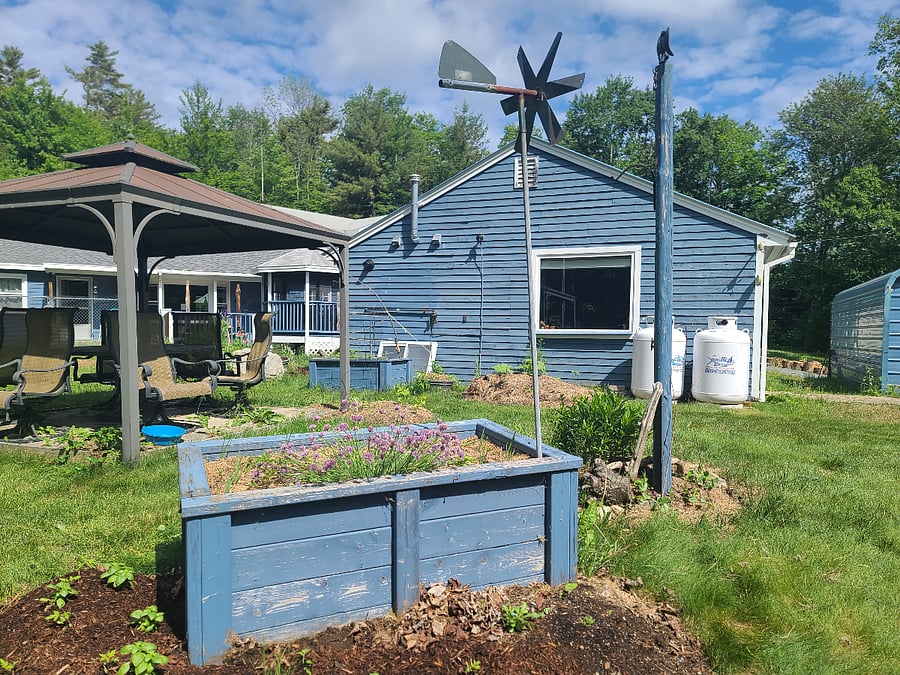 View from the back of the cottage looking in. That big window is in the kitchen. Notice the main house to the left. This is a guesthouse on an active property. Homeowners live in the main house.