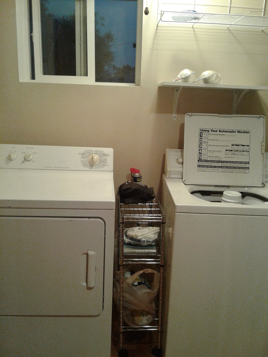 Compact laundry room that uses every available space.
