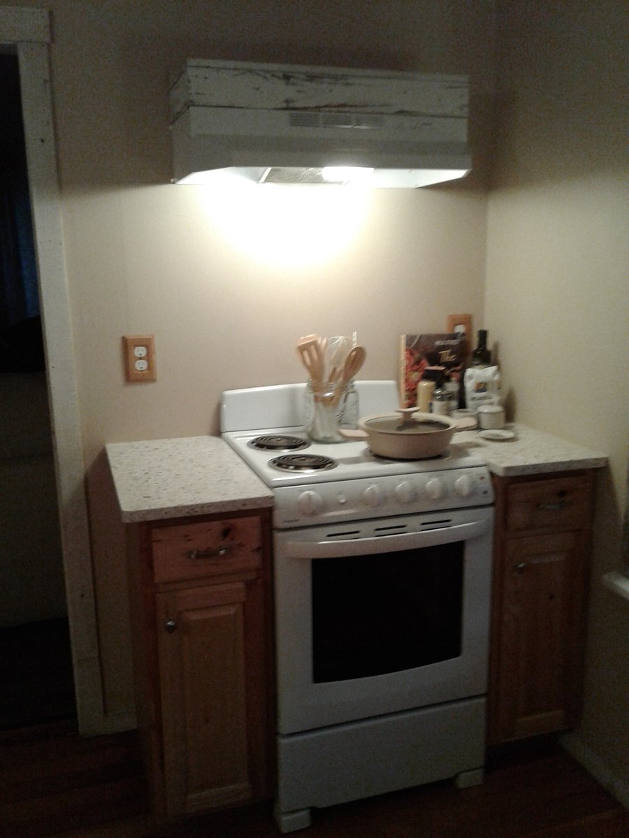 Cook up your favs in this cozy kitchen. Four burner electric range.