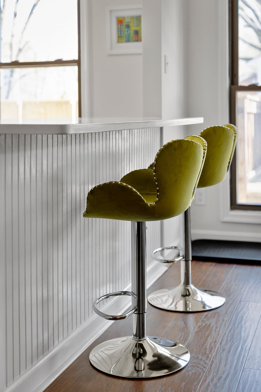 Fun barstools at kitchen island for additional seating