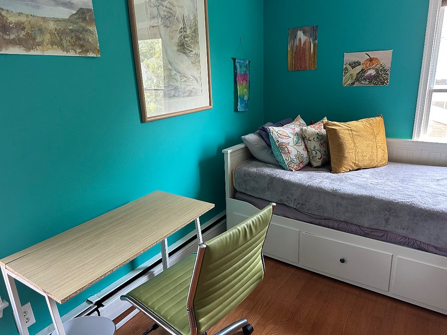 Upstairs bedroom. Trundle bed easily opens to a queen size bed. Cathedral ceilings, ceiling fan, closet space, dresser, dedicated work space, lots of light.