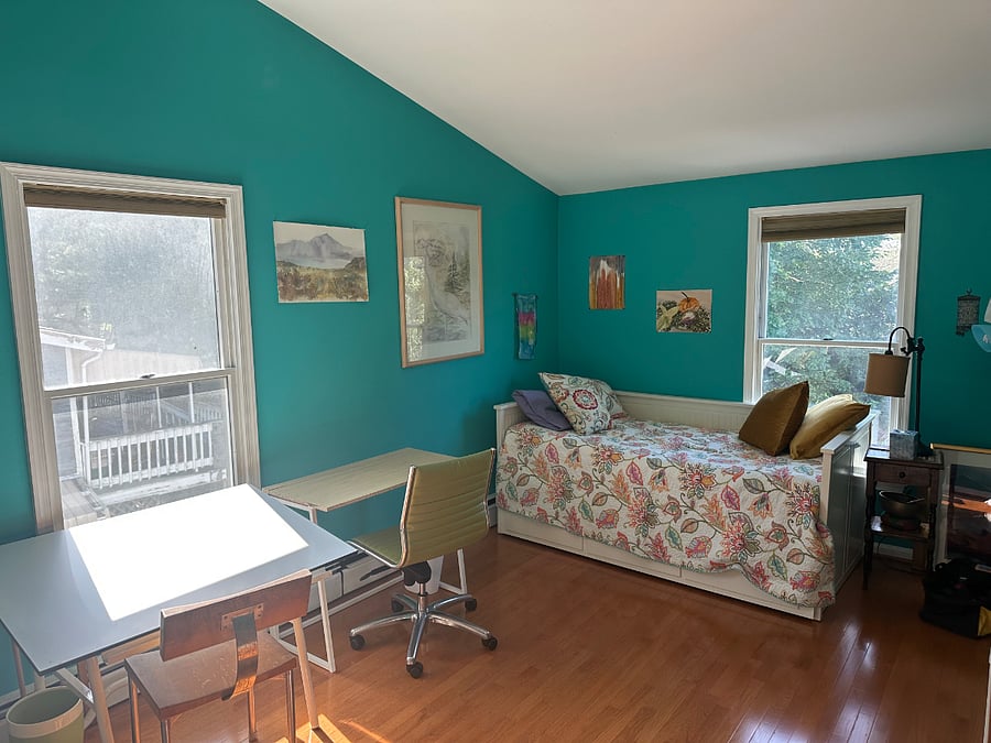 Upstairs bedroom. Trundle bed easily opens to a queen size bed. Cathedral ceilings, ceiling fan, closet space, dresser, dedicated work space, lots of light.