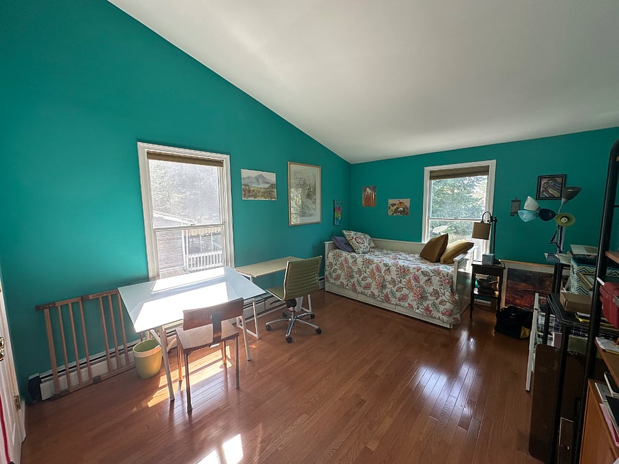 Upstairs bedroom. Trundle bed easily opens to a queen size bed. Cathedral ceilings, ceiling fan, closet space, dresser, dedicated work space, lots of light.