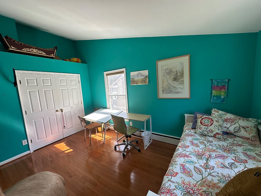 Upstairs bedroom. Trundle bed easily opens to a queen size bed. Cathedral ceilings, ceiling fan, closet space, dresser, dedicated work space, lots of light.