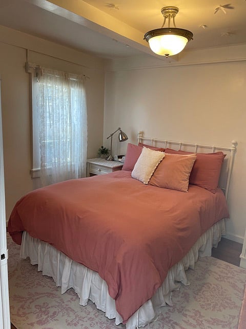 The bedroom has a full-sized bed with a Stearns & Foster pillow-top mattress.
