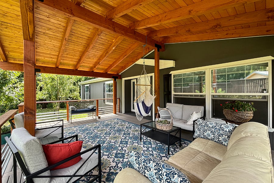 Custom-built spacious back porch with lots of seating