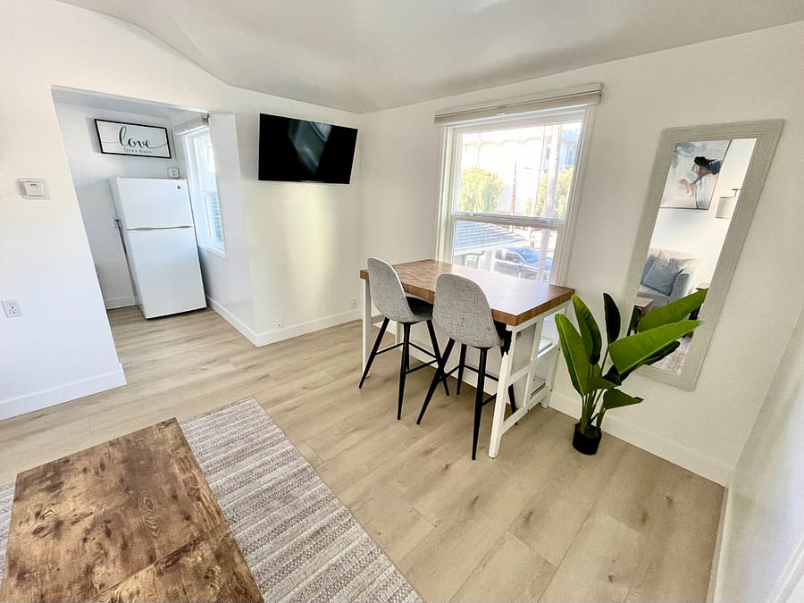 beautiful work/dining table with a gorgeous street view