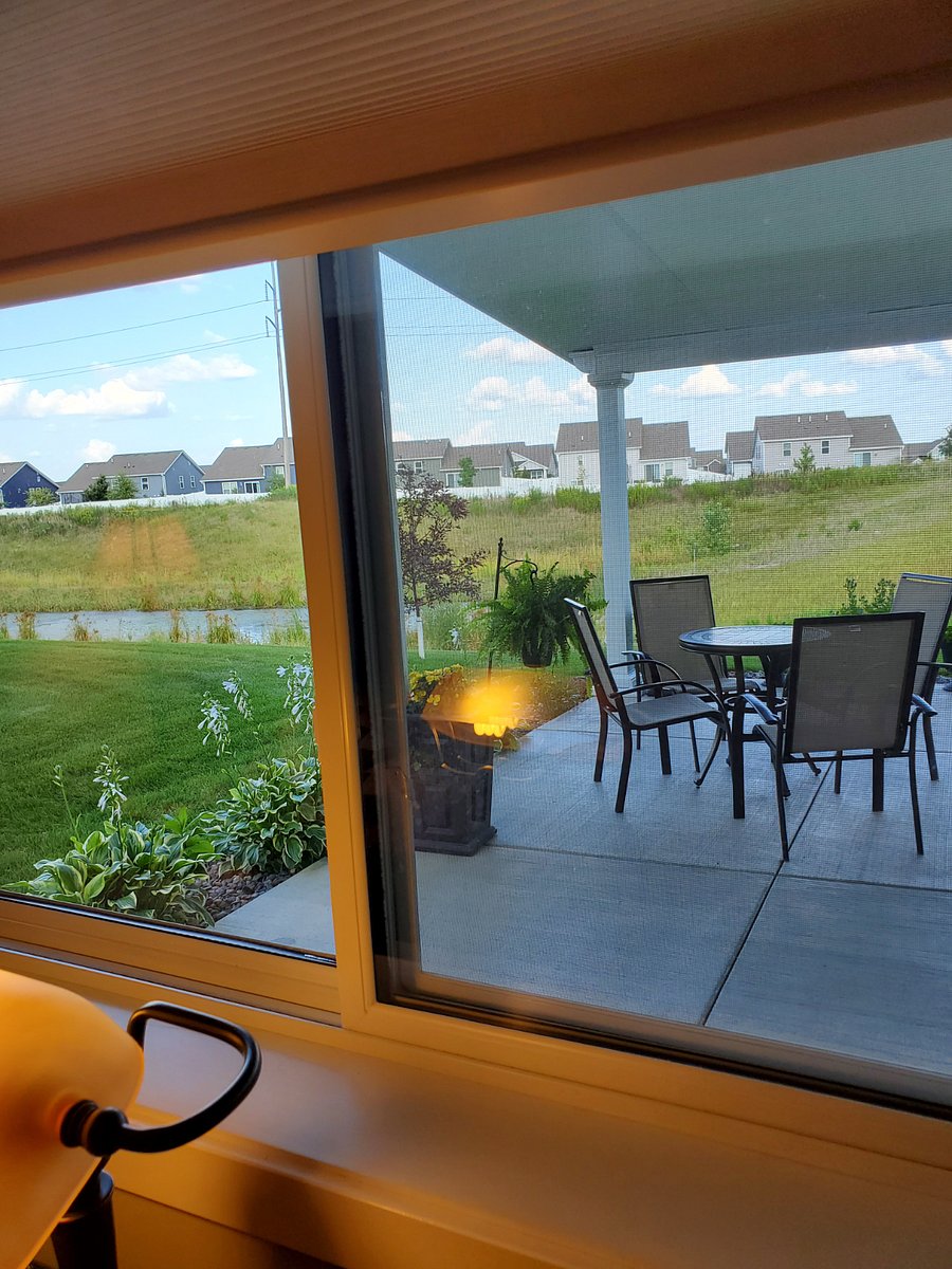 Desk view of patio area and small pond