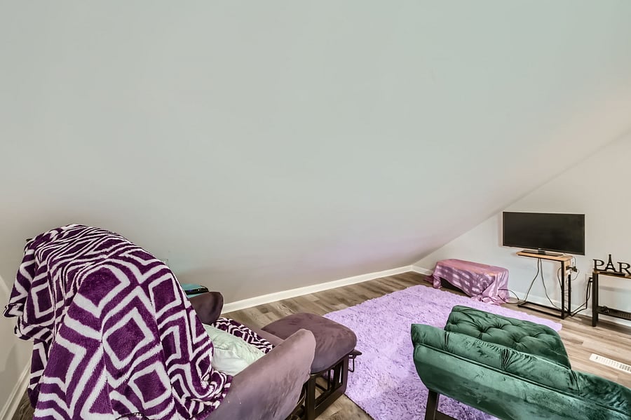 Sitting room with recliner chair, chaise and TV