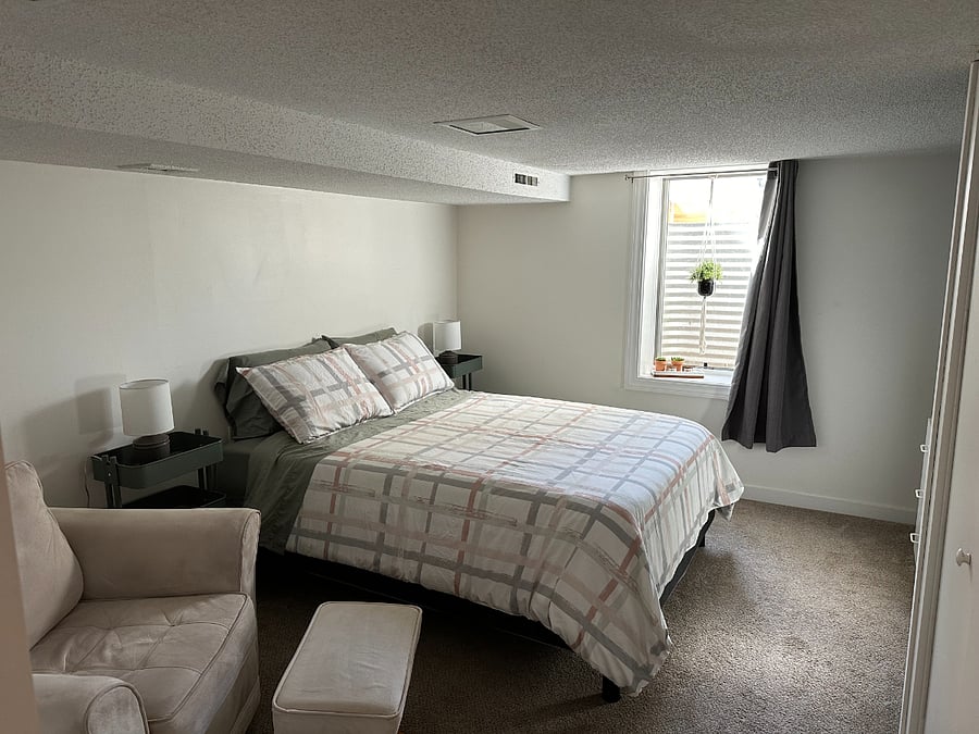 Large egress window provides tons of natural light! Black-out curtains in both bedrooms!