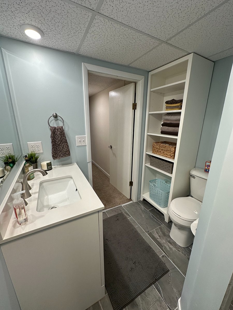 Newly renovated bathroom with new large vanity and mirror, and lots of storage!