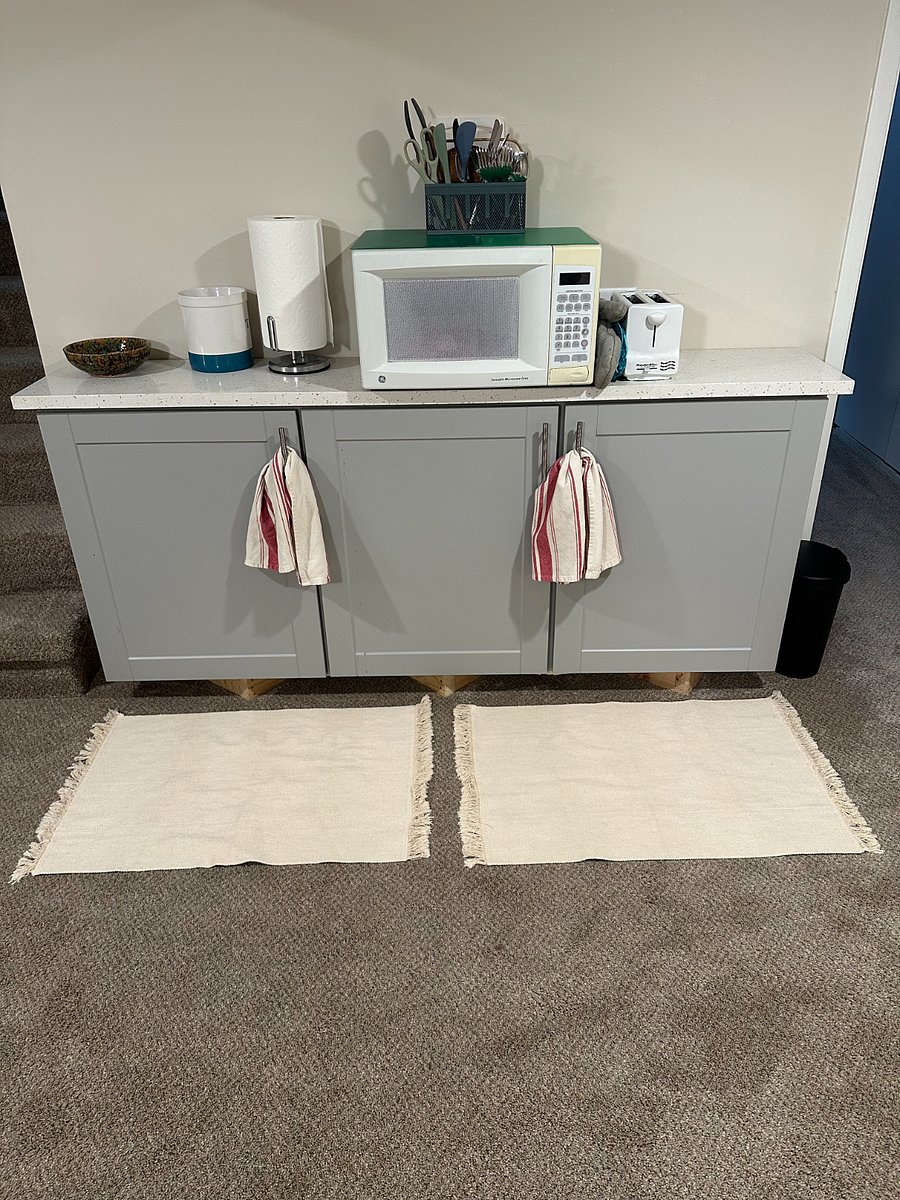 Microwave, toaster, and storage cabinets